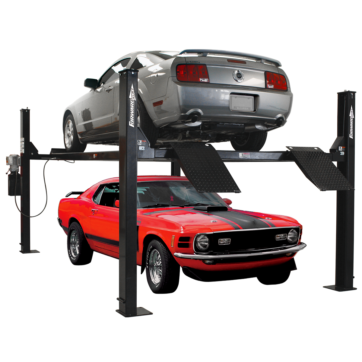 Four-post car lift storing one vehicle above another in a home garage